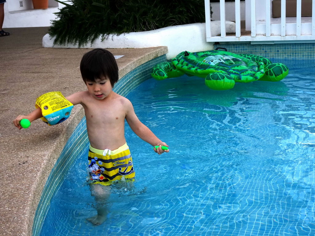 Max with an inflatable turtle at the main swimming pool at the Prinsotel Alba Hotel Apartamentos