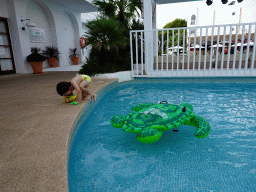 Max with an inflatable turtle at the main swimming pool at the Prinsotel Alba Hotel Apartamentos