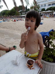 Max having ice cream at the Heladería Torreón restaurant at the Cala Gran beach