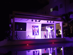 Elvis imitator at the main swimming pool at the Prinsotel Alba Hotel Apartamentos, by night