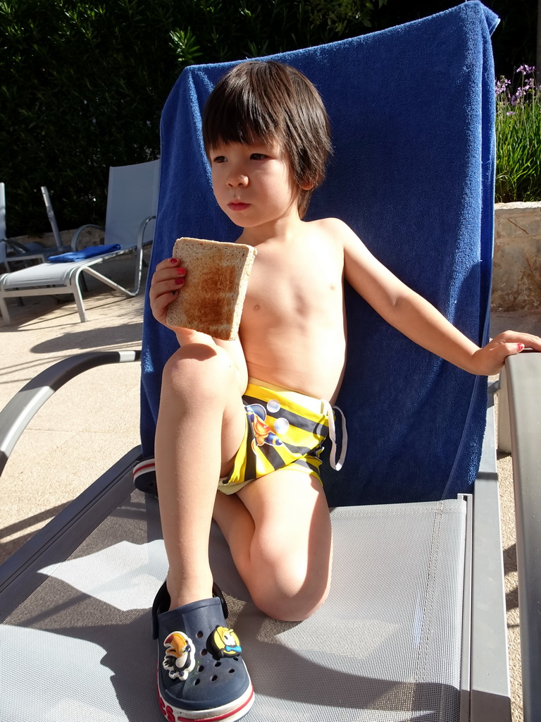 Max eating at toast at the main swimming pool at the Prinsotel Alba Hotel Apartamentos