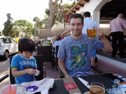Max playing with slime and Tim with a beer at the Restaurante Cafetería Mediterraneo