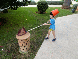 Max playing with a fishing net and a bucket at the Prinsotel Alba Hotel Apartamentos