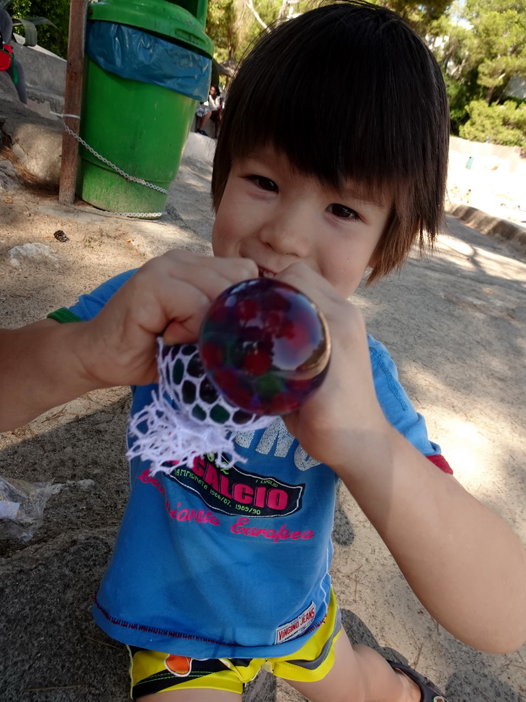 Max with a toy at the Cala d`Or beach