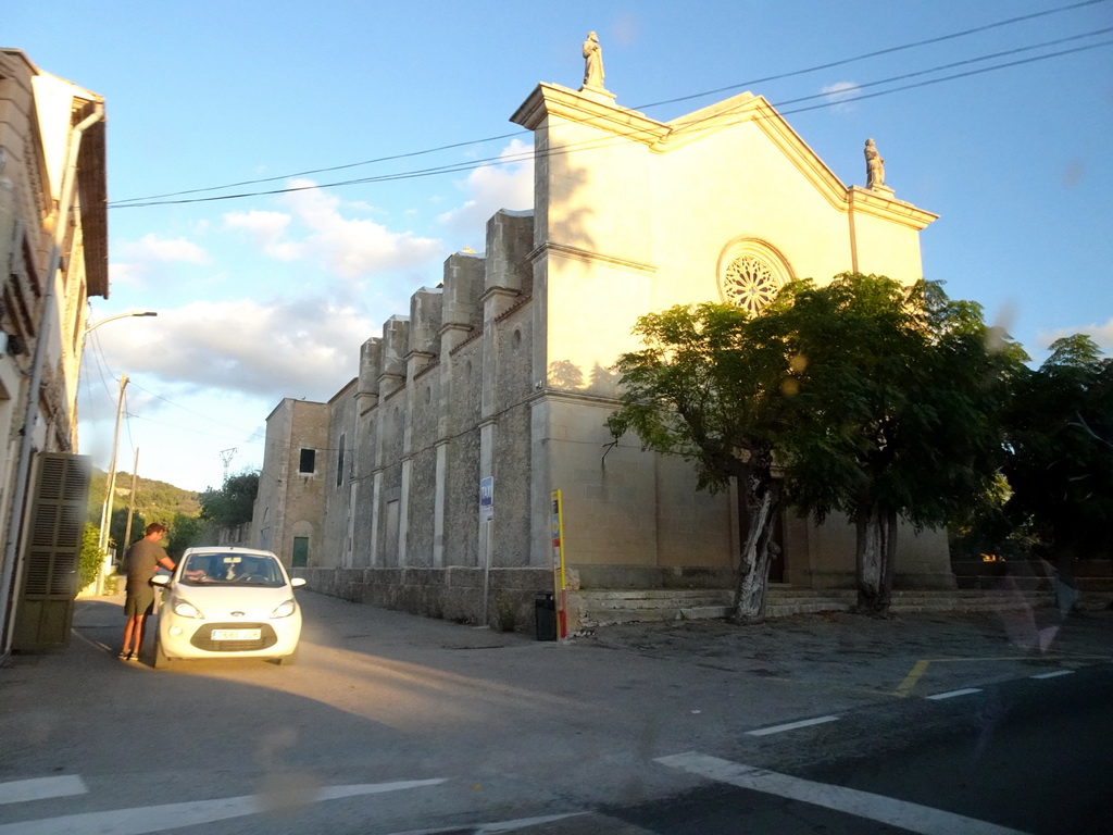 The west side of the Esglesia D`es Carritxó church at the town of Es Carritxó, viewed from the rental car on the Ma-4016 road