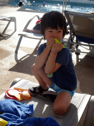 Max playing with a toy at the main swimming pool at the Prinsotel Alba Hotel Apartamentos