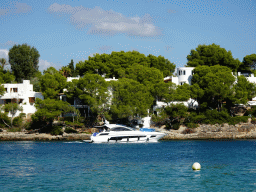 Boat and houses at the Caló d`es Pou beach