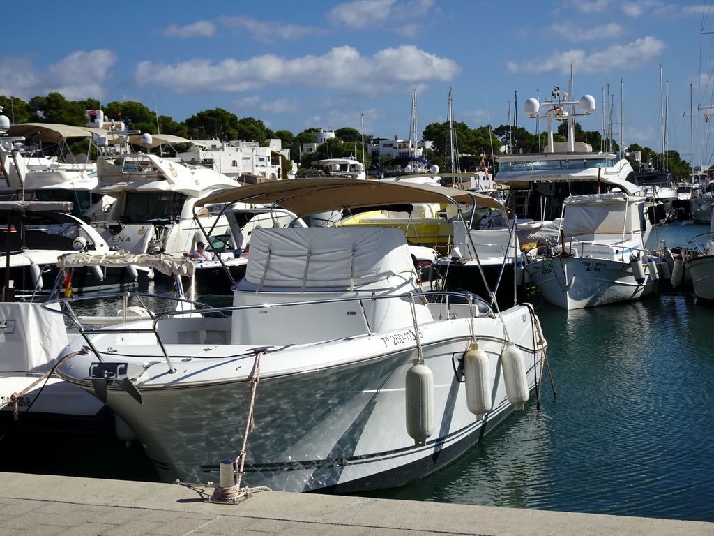 Boats at the southwest side of the Port Esportiu Marina de Cala d`Or harbour, viewed from the Avinguda de Cala Llonga street