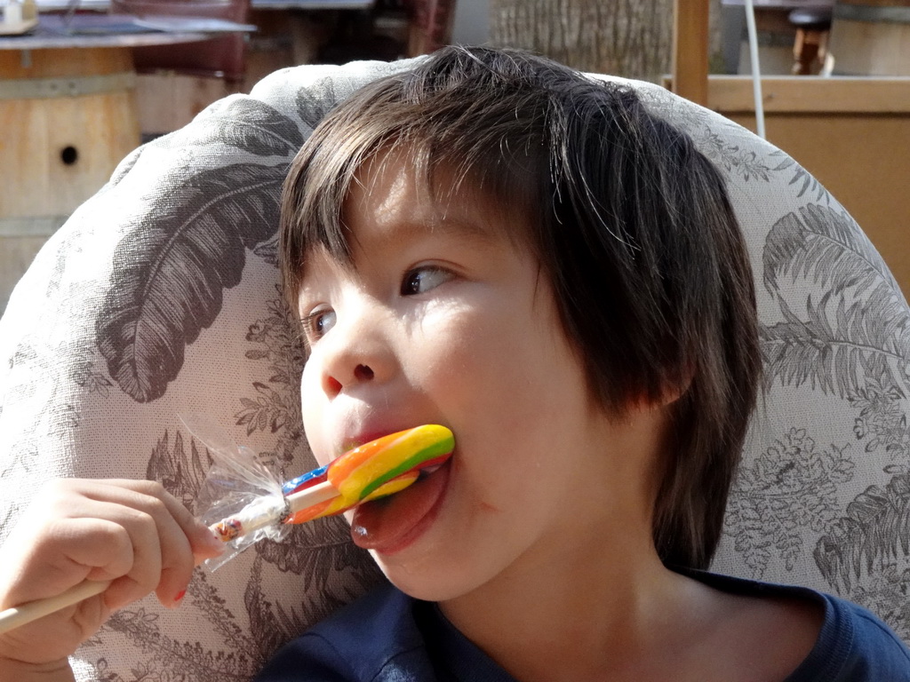 Max with a lollipop at the Taberna Lobito Bueno restaurant at the Avinguda d`en Fernando Tarragó