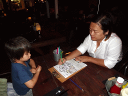 Miaomiao and Max colouring a drawing at the Restaurant Meatclub Mallorca at the Carrer d`en Andreu Roig street