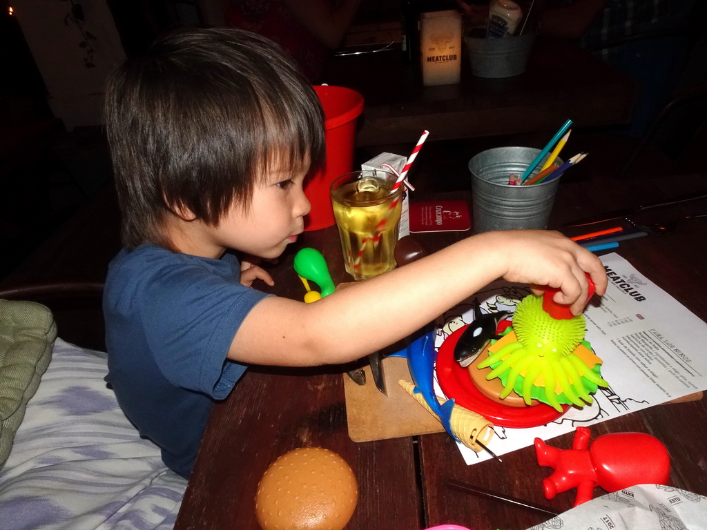 Max playing with toys at the Restaurant Meatclub Mallorca