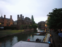 Punt boats in the Cam river and Magdalene College, viewed from Magdalene street