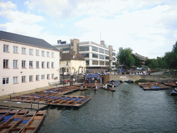Punt boats in the Cam river and Queens`s College, viewed from Silver Street