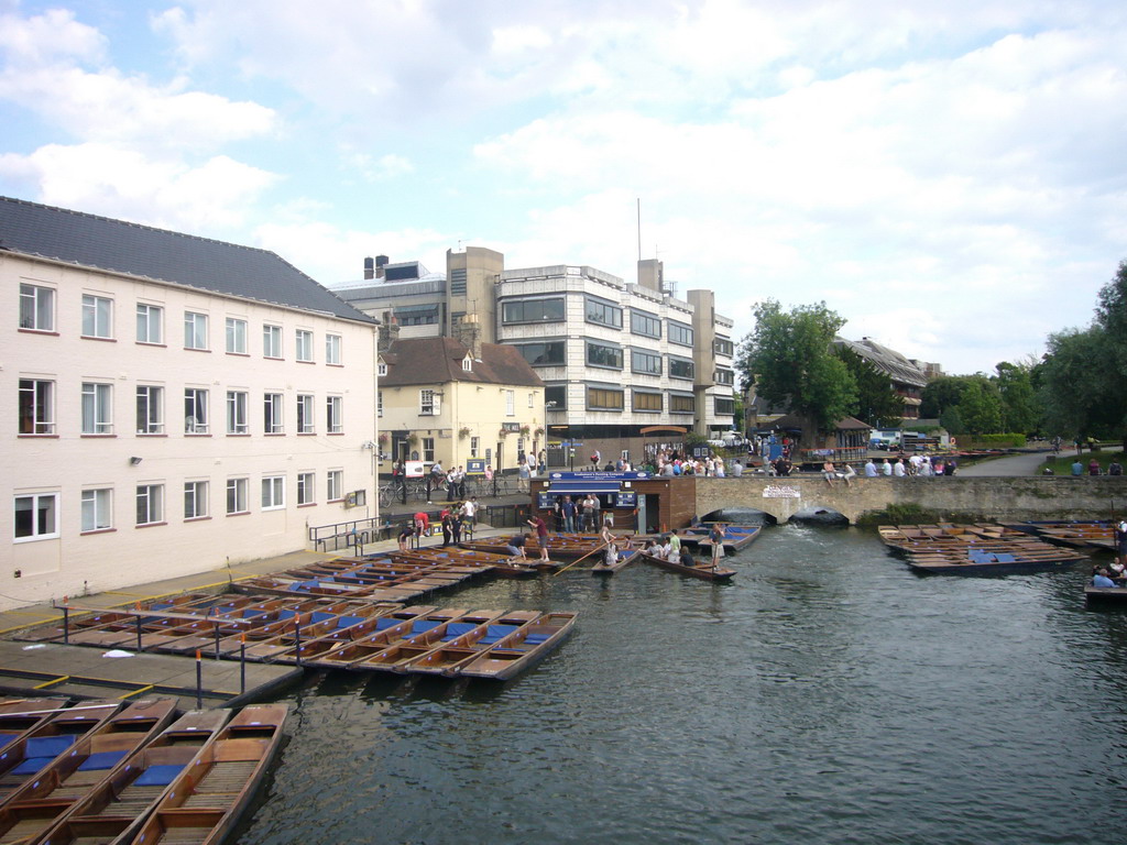Punt boats in the Cam river and Queens`s College, viewed from Silver Street