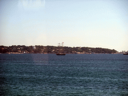 Seaside and a boat in the Mediterranean Sea, viewed from train from Nice