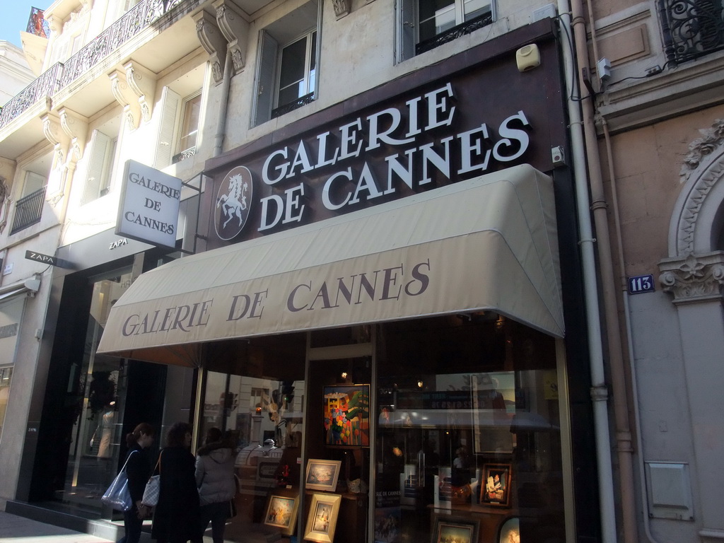 Art shop `Galerie de Cannes` at the Rue d`Antibes shopping street, viewed from the Cannes tourist train