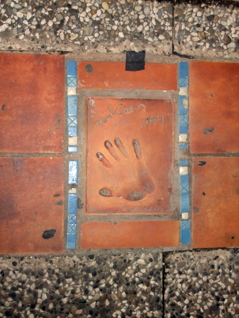 Hand print of Joel Coen at the Cannes Walk of Fame, by night