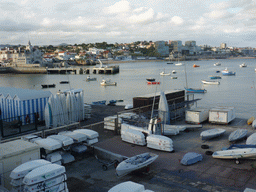 Boats in the Cascais harbour with the Capitania Porto Cascais building, viewed from the Passeio Dona Maria Pia walkway