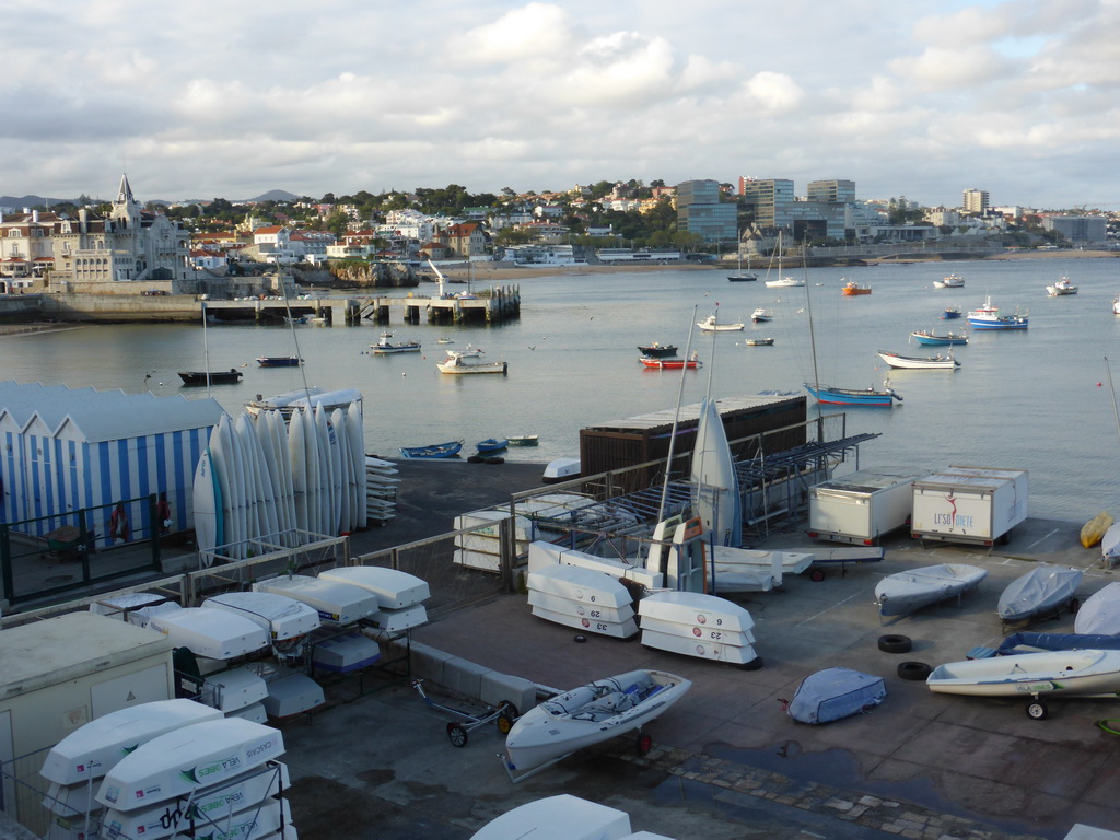 Boats in the Cascais harbour with the Capitania Porto Cascais building, viewed from the Passeio Dona Maria Pia walkway