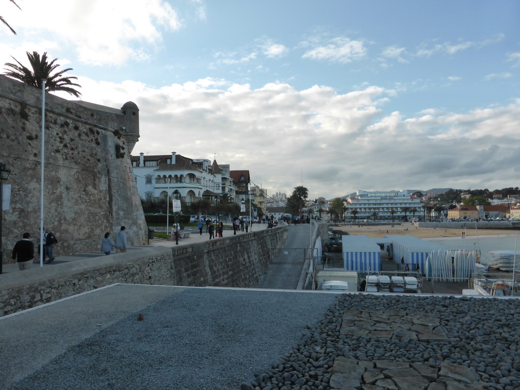 The Passeio Dona Maria Pia walkway, the northeast corner of the wall of the Cascais citadel and the beach at the Cascais harbour, viewed from the Clube Naval de Cascais