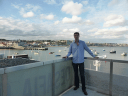 Tim at the Clube Naval de Cascais with a view on the Cascais harbour and the Capitania Porto Cascais building