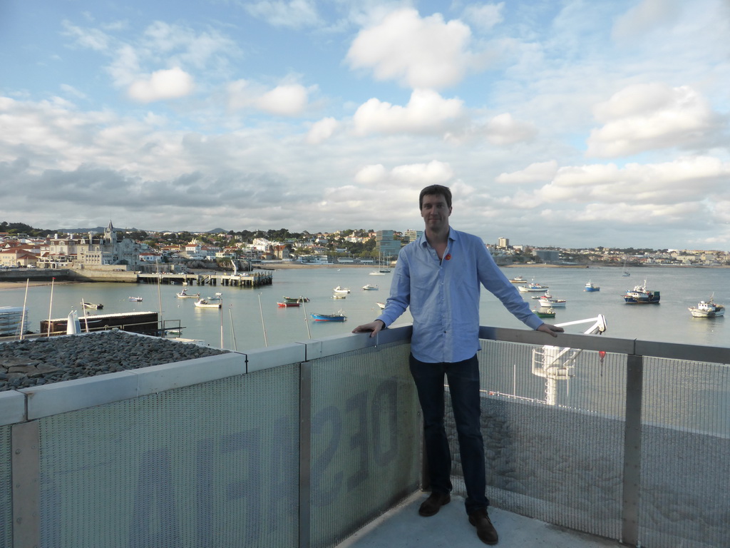 Tim at the Clube Naval de Cascais with a view on the Cascais harbour and the Capitania Porto Cascais building
