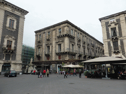 The southwest side of the Piazza del Duomo square with the Fontana dell`Amenano fountain and the Palazzo del Pardo palace