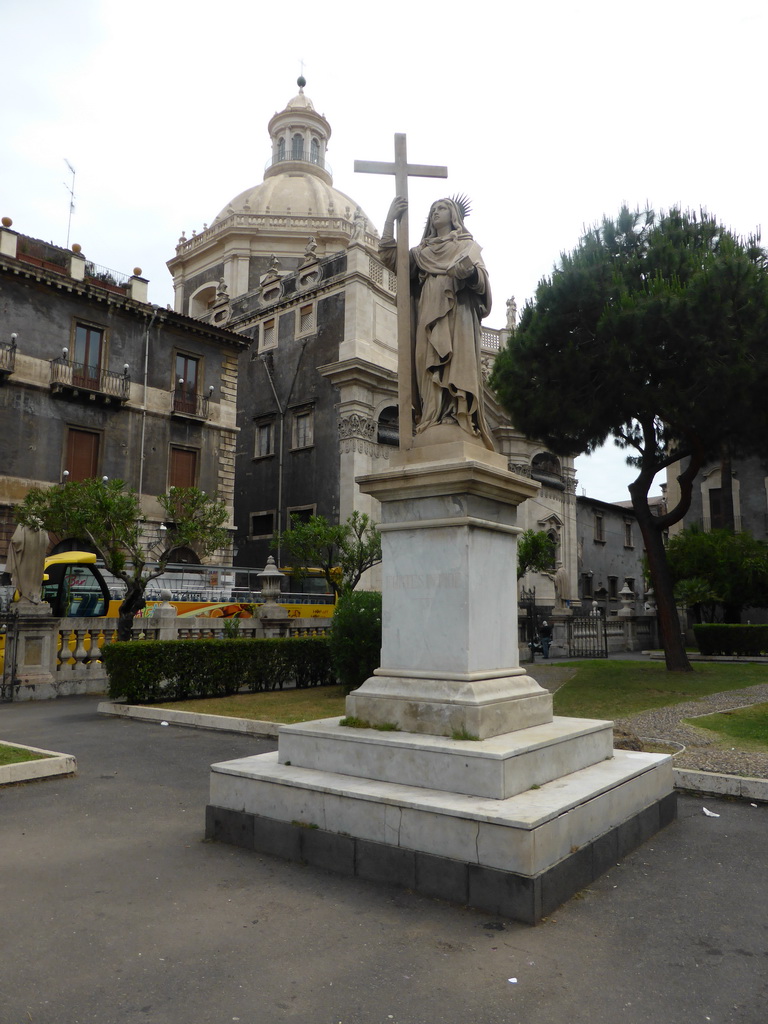 Statue in the garden of the Cattedrale di Sant`Agata cathedral, the Palazzo S. Alfano palace and the Chiesa della Badia di Sant`Agata church