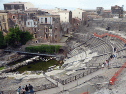 The cavea and orchestra of the Greek-Roman Theatre, viewed from the Casa Liberti house