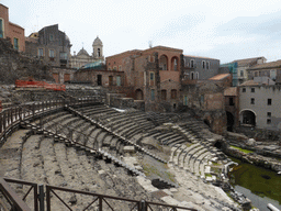 The cavea of the Greek-Roman Theatre, and the towers of the Chiesa di San Francesco e l`Immacolata church