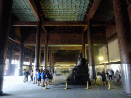 The right side of the Copper Statue of the Yongle Emperor in the Hall of Eminent Favour at the Changling Tomb of the Ming Dynasty Tombs