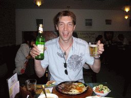 Tim having dinner and beer in a steak restaurant in the city center