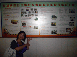 Miaomiao with a poster of her former department at the School of Basic Medical Sciences of Central South University