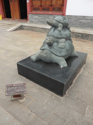 Statue of three tortoises at the front square of the Yongqing Temple