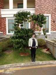 Miaomiao with a tree at the Fushan Town Center of Coffee Culture and Customs