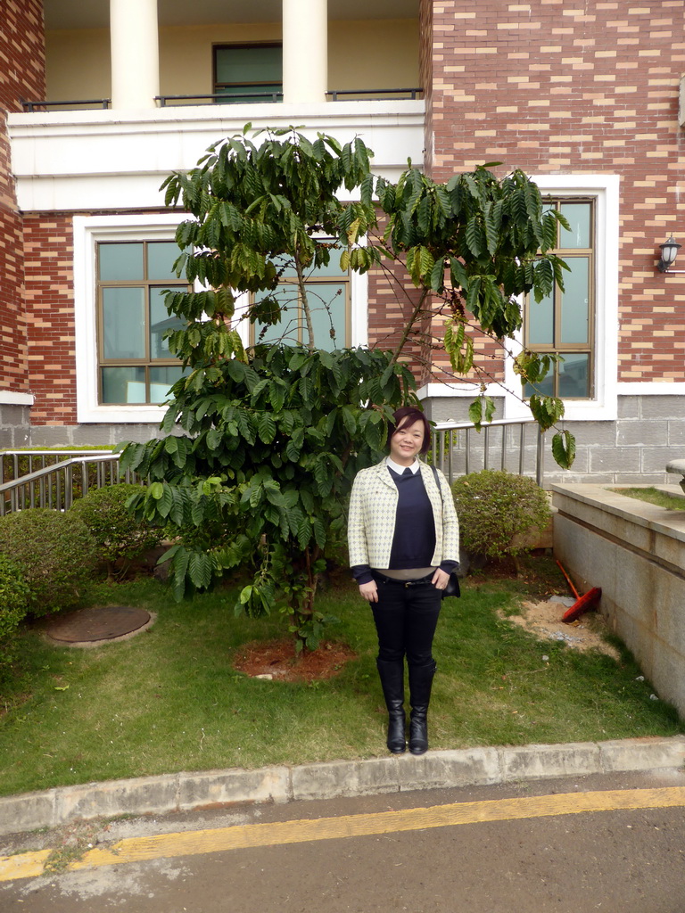 Miaomiao with a tree at the Fushan Town Center of Coffee Culture and Customs