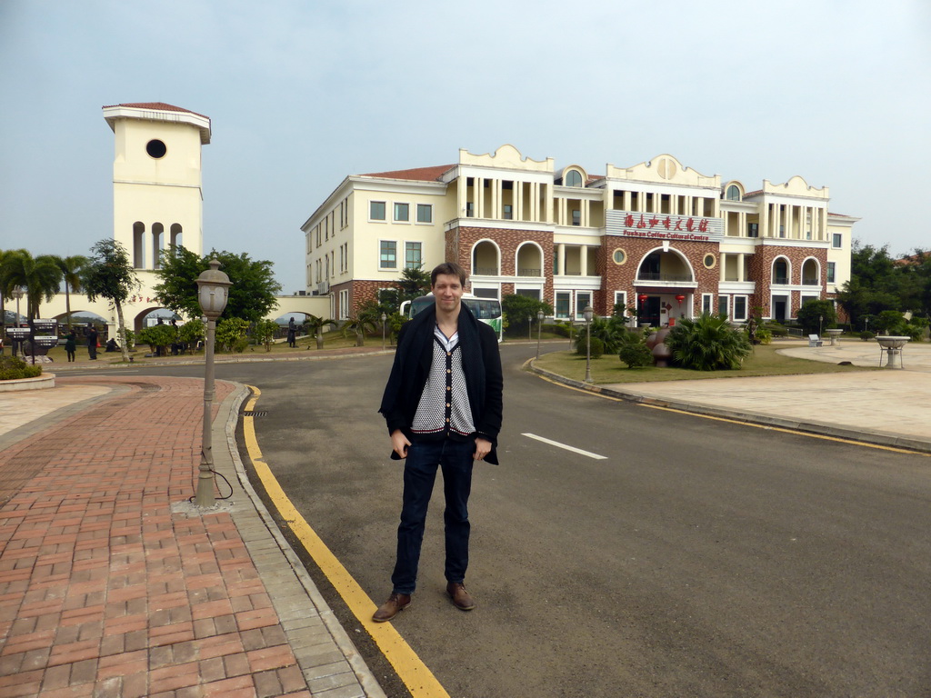 Tim at the central square with the main building of the Fushan Town Center of Coffee Culture and Customs