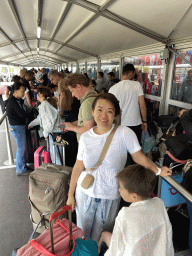 Miaomiao and Max waiting in line in front of the Rotterdam The Hague Airport