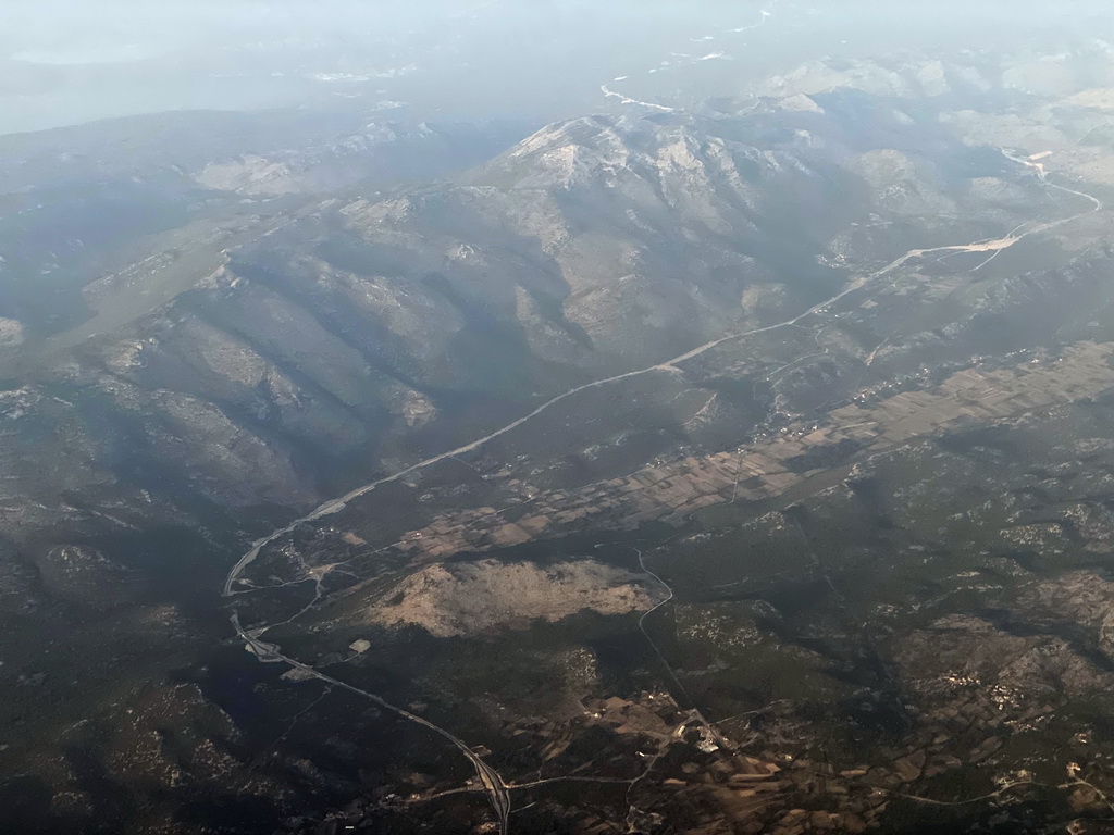 Hills and the towns of Dobrovo and Gradac at Bosnia and Herzegovina, viewed from the airplane from Rotterdam