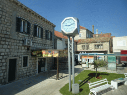 Clock at the bus terminal at the etalite Rat square at Cavtat, viewed from the tour bus to Perast