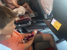Max playing `Pokémon Shield` on the Nintendo Switch in the tour bus to Perast on the D8 road at the Croatia-Montenegro border crossing near the town of Plocice