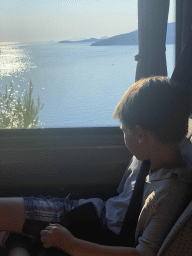 Max in the bus from the Grand Hotel Park to Dubrovnik Airport on the D8 road near the town of Plat, with a view on the Adriatic Sea