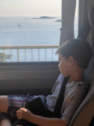 Max in the bus from the Grand Hotel Park to Dubrovnik Airport on the D8 road near the town of Plat, with a view on the Adriatic Sea