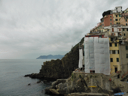 Houses at the north side of the harbour of Riomaggiore and the Via dell`Amore path to Manarola