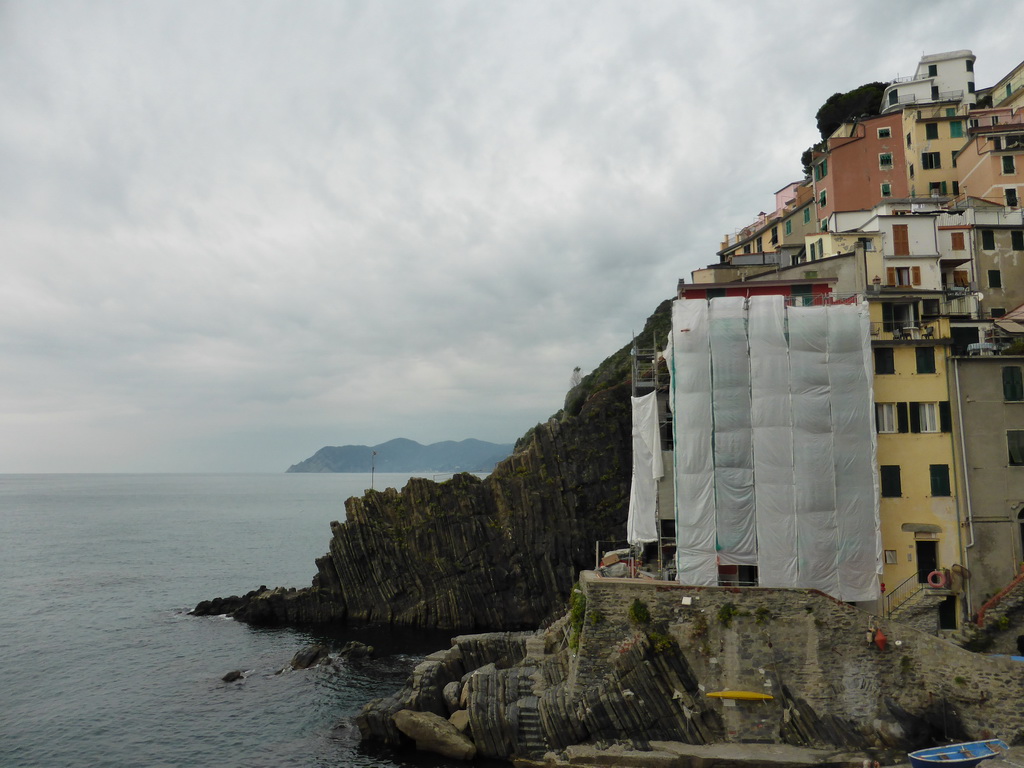 Houses at the north side of the harbour of Riomaggiore and the Via dell`Amore path to Manarola