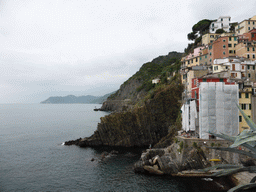Houses at the north side of the harbour of Riomaggiore and the Via dell`Amore path to Manarola