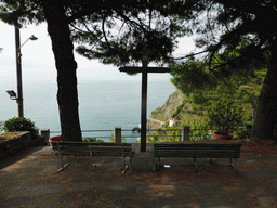 Cross at the north side of the Riomaggiore Castle with a view on the Via dell`Amore path to Manarola