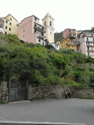 The Via Discovolo street at Manarola with the bell tower of the Chiesa di San Lorenzo church
