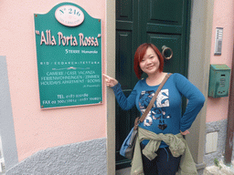 Miaomiao in front of the `Alla Porta Rossa` ecological building at the Via Rolandi street at Manarola