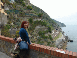 Miaomiao at the Piazza Castello square, with a view on the Manarola railway station